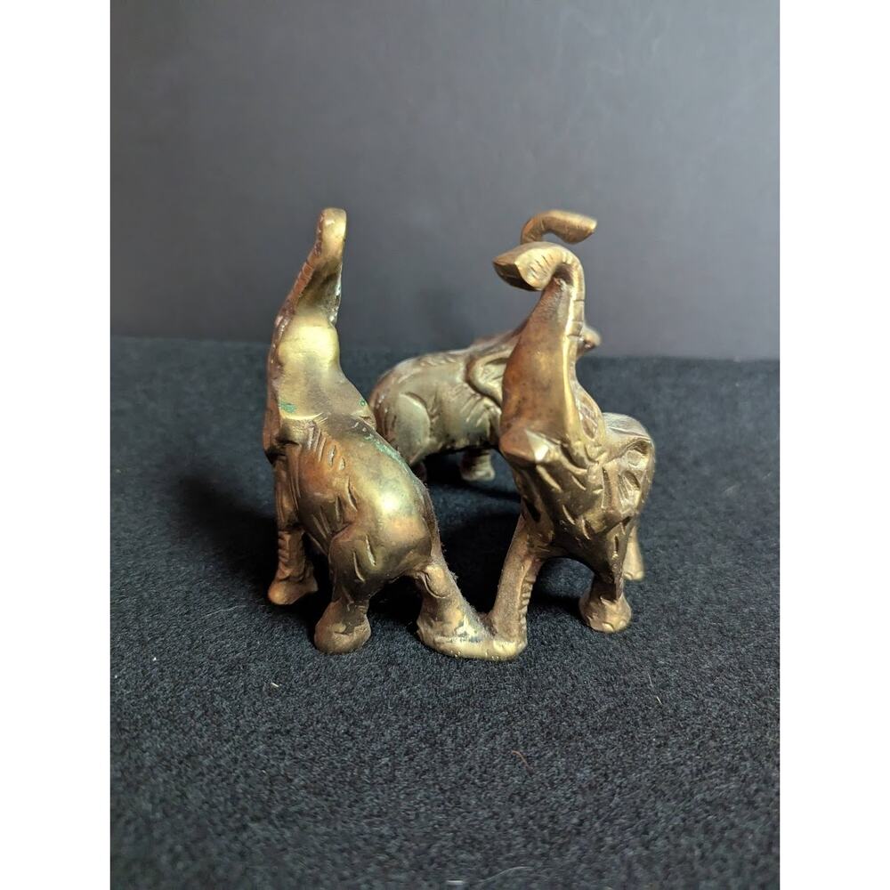 Small vintage bronze ring of 3 elephants trunks raised all attached